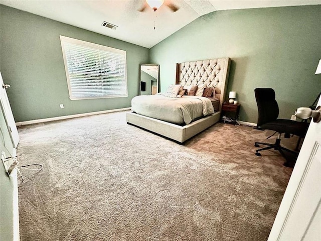 carpeted bedroom featuring ceiling fan and vaulted ceiling