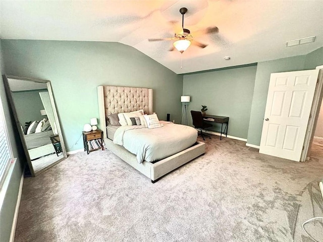 bedroom featuring ceiling fan, carpet floors, and vaulted ceiling