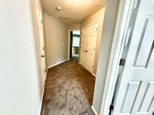 hallway featuring carpet flooring