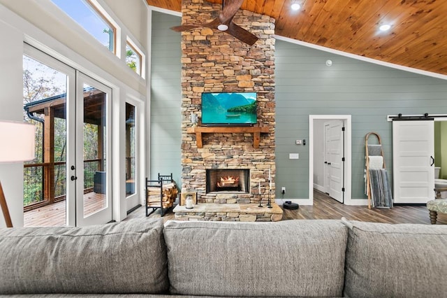 living room featuring hardwood / wood-style floors, french doors, high vaulted ceiling, and wood ceiling