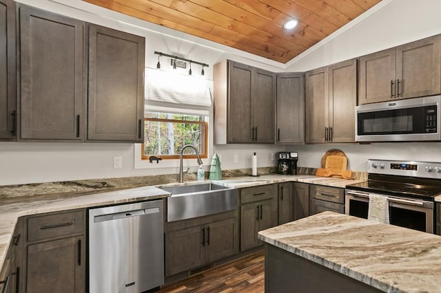 kitchen featuring light stone countertops, appliances with stainless steel finishes, sink, wooden ceiling, and lofted ceiling