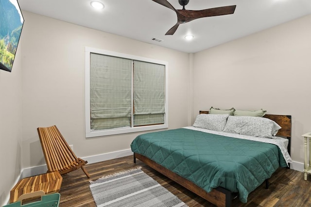 bedroom featuring dark hardwood / wood-style floors and ceiling fan