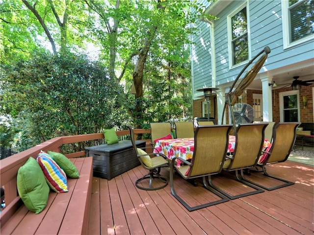 wooden deck featuring ceiling fan