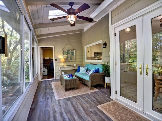 sunroom / solarium featuring vaulted ceiling with beams, wooden ceiling, and ceiling fan