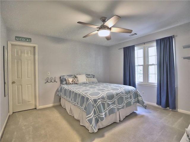 carpeted bedroom featuring ceiling fan