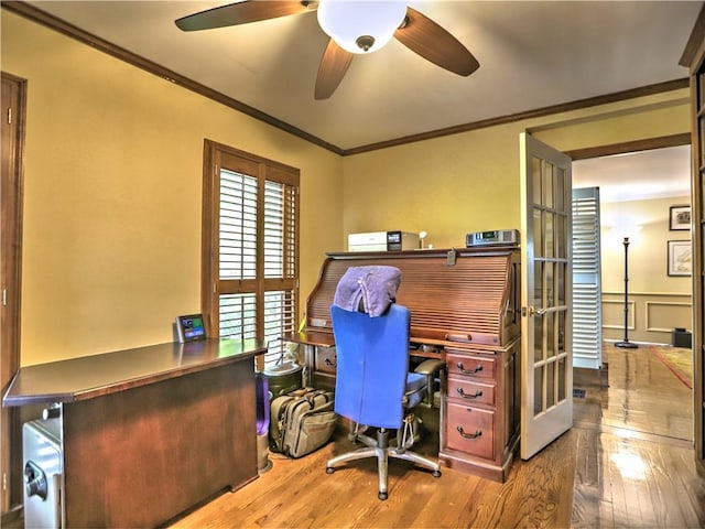 office with ceiling fan, ornamental molding, and hardwood / wood-style floors