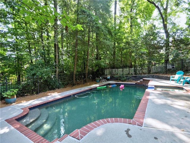 view of swimming pool with a patio area