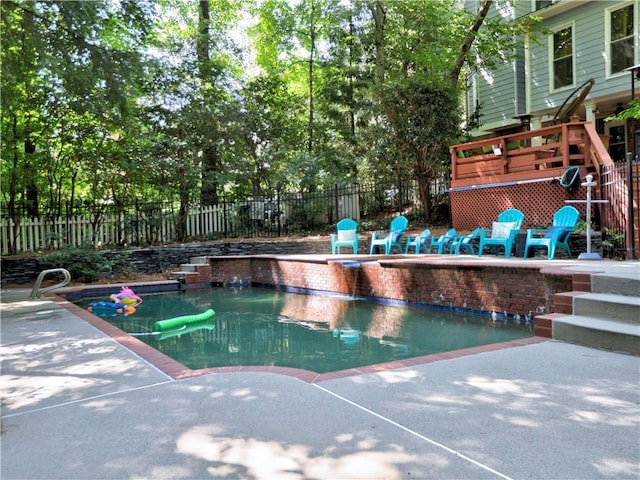 view of pool featuring a patio