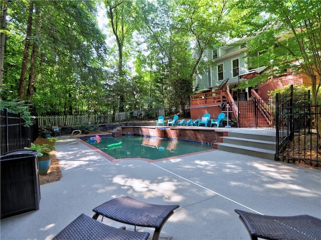 view of swimming pool featuring a patio