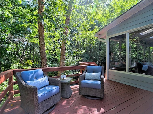 wooden deck featuring a sunroom