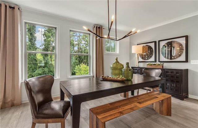 1088 Battery Park Rd, Decatur, GA 30033 - dining space featuring a chandelier, light wood-type flooring, crown molding, and baseboards