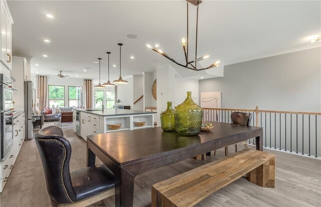 1088 Battery Park Rd, Decatur, GA 30033 - dining space with light wood-style floors, a chandelier, ceiling fan, recessed lighting, and stairway