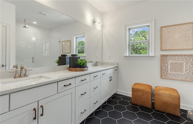 1088 Battery Park Rd, Decatur, GA 30033 - bathroom with healthy amount of natural light, double vanity, a stall shower, and baseboards