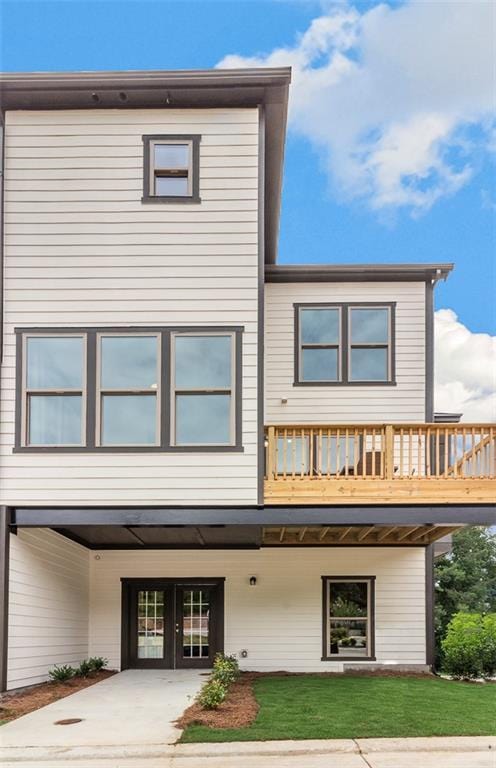 1088 Battery Park Rd, Decatur, GA 30033 - rear view of property with a carport, french doors, a lawn, and driveway