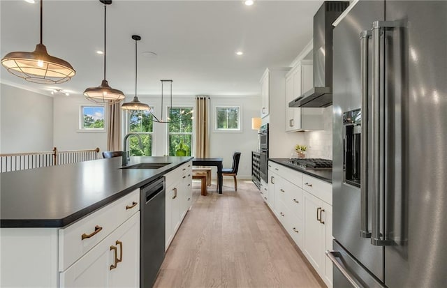 1088 Battery Park Rd, Decatur, GA 30033 - kitchen with appliances with stainless steel finishes, dark countertops, wall chimney exhaust hood, a sink, and recessed lighting