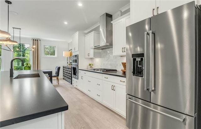 1088 Battery Park Rd, Decatur, GA 30033 - kitchen with appliances with stainless steel finishes, wall chimney range hood, a sink, dark countertops, and white cabinetry