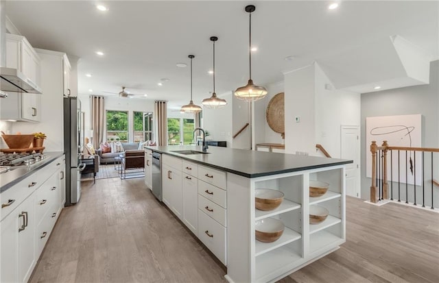 1088 Battery Park Rd, Decatur, GA 30033 - kitchen featuring a sink, dark countertops, stainless steel appliances, light wood finished floors, and a ceiling fan
