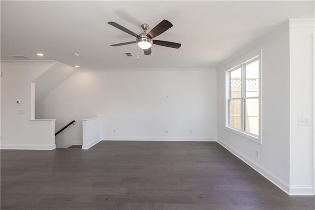 interior space with ceiling fan, dark hardwood / wood-style floors, and ornamental molding