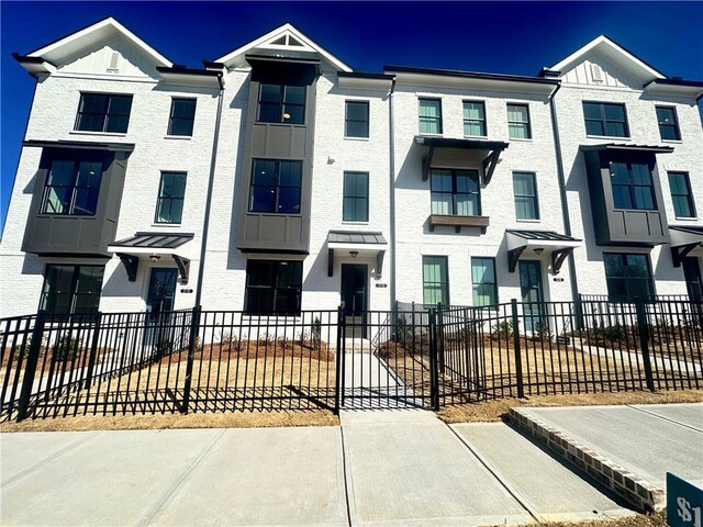 view of property featuring a front yard