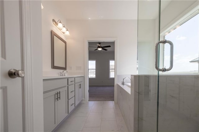 bathroom with ceiling fan, shower with separate bathtub, and vanity