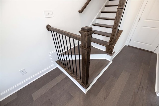 stairway featuring hardwood / wood-style flooring