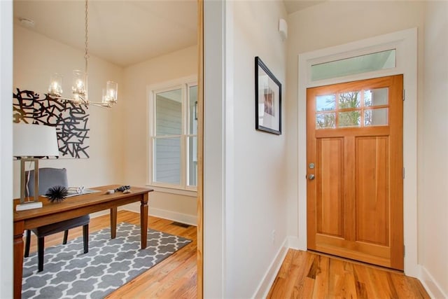 1240 Oakland Ter SW Unit B, Atlanta, GA 30310 - entrance foyer with baseboards, visible vents, light wood-style flooring, and an inviting chandelier