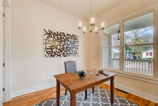 1240 Oakland Ter SW Unit B, Atlanta, GA 30310 - office area featuring baseboards, visible vents, wood finished floors, and a chandelier