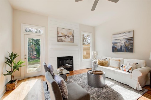 1240 Oakland Ter SW Unit B, Atlanta, GA 30310 - living area featuring a large fireplace, a ceiling fan, and wood finished floors