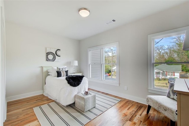 1240 Oakland Ter SW Unit B, Atlanta, GA 30310 - bedroom with baseboards, visible vents, and wood finished floors