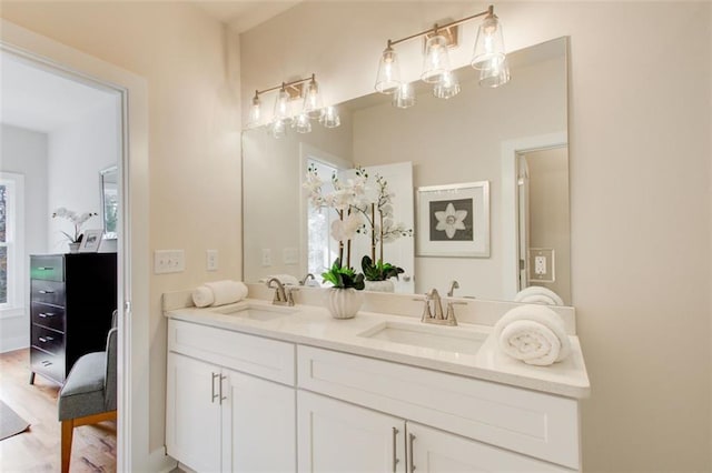 1240 Oakland Ter SW Unit B, Atlanta, GA 30310 - bathroom with double vanity, a sink, a notable chandelier, and wood finished floors