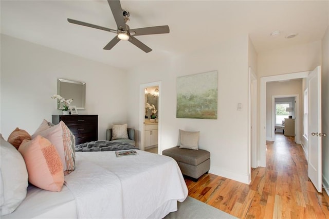 1240 Oakland Ter SW Unit B, Atlanta, GA 30310 - bedroom with light wood-style flooring, connected bathroom, baseboards, and ceiling fan