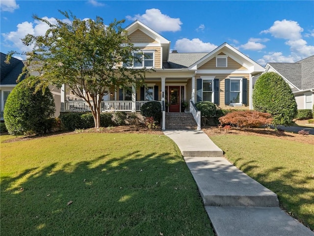 craftsman inspired home featuring a front yard and a porch