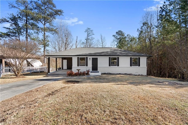 single story home with a front lawn and a carport