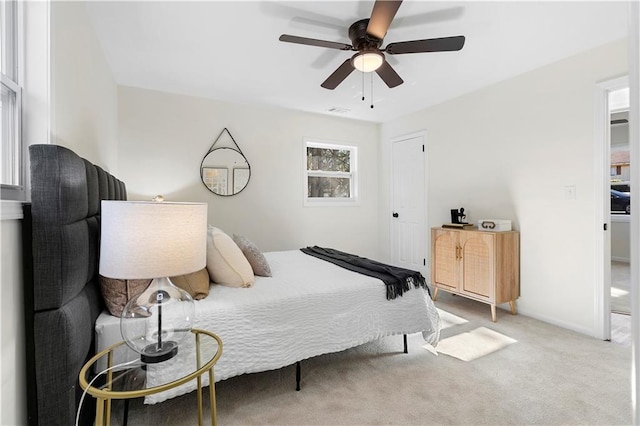 carpeted bedroom featuring ceiling fan