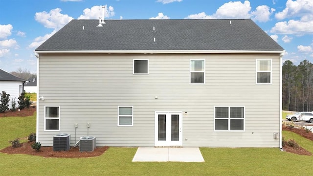 back of property with a patio area, a yard, and central AC unit