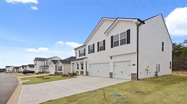 view of front of house featuring a front yard and a garage