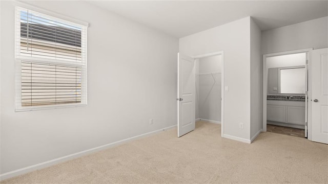 unfurnished bedroom with light carpet and multiple windows