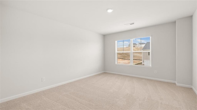 empty room featuring light colored carpet