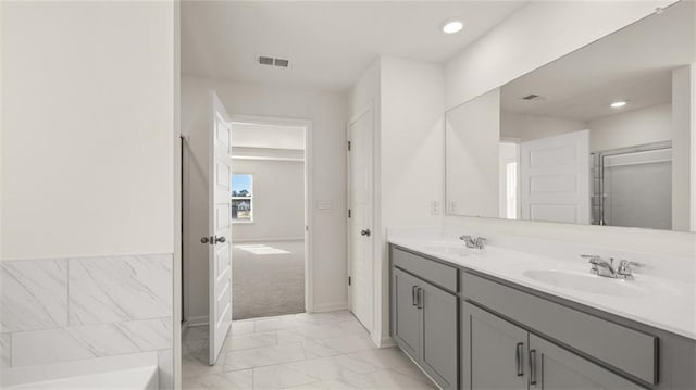 1141 Kingston Ave, Buckhead, GA 30625 - full bath featuring marble finish floors, double vanity, recessed lighting, baseboards, and a tub
