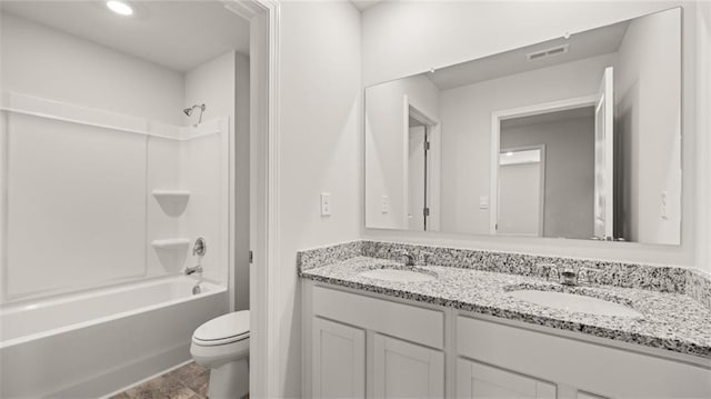 full bathroom with vanity, toilet, and shower / washtub combination