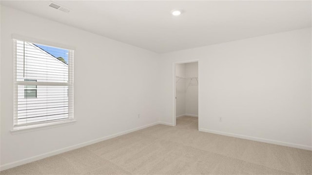 1141 Kingston Ave, Buckhead, GA 30625 - unfurnished bedroom with light colored carpet, baseboards, a walk in closet, a closet, and recessed lighting