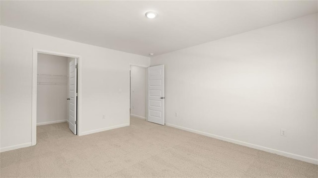 1141 Kingston Ave, Buckhead, GA 30625 - unfurnished bedroom featuring light colored carpet, baseboards, a spacious closet, and a closet
