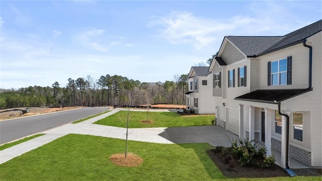 1141 Kingston Ave, Buckhead, GA 30625 - view of green lawn featuring concrete driveway and an attached garage