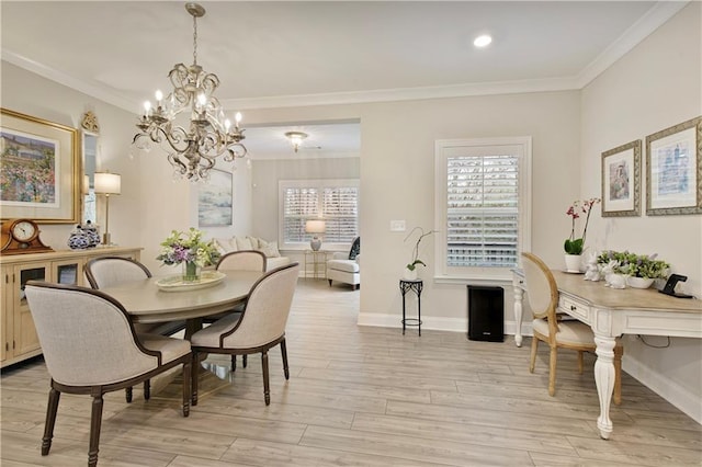 dining area with ornamental molding, baseboards, plenty of natural light, and light wood finished floors