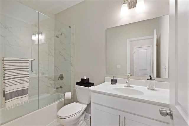 bathroom with toilet, shower / bath combination with glass door, and vanity