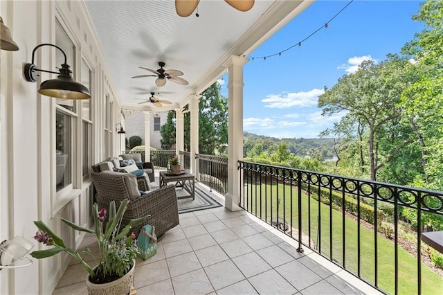 balcony featuring ceiling fan
