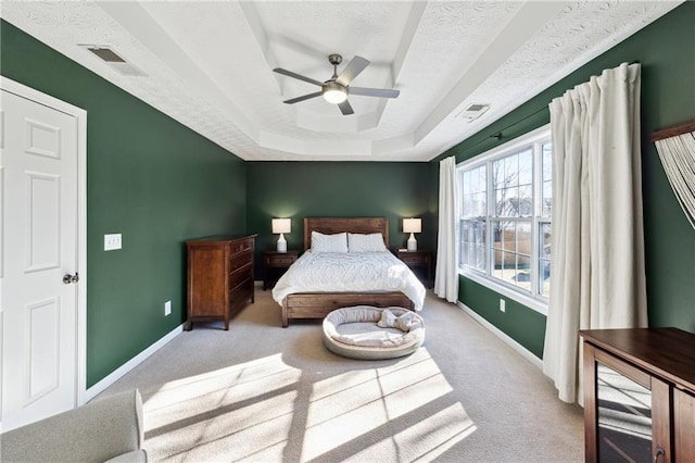 8450 Jot Em Down Rd, Gainesville, GA 30506 - carpeted bedroom with a tray ceiling, visible vents, baseboards, and ceiling fan