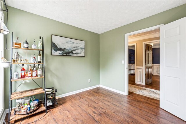 8450 Jot Em Down Rd, Gainesville, GA 30506 - interior space featuring baseboards, a textured ceiling, and wood finished floors