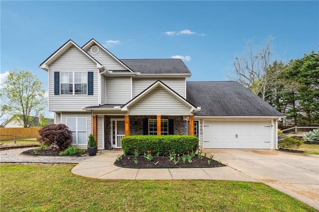 8450 Jot Em Down Rd, Gainesville, GA 30506 - traditional home featuring fence, covered porch, a garage, concrete driveway, and a front lawn