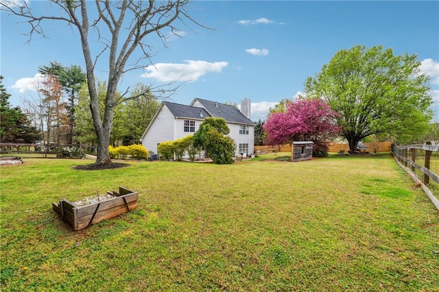 8450 Jot Em Down Rd, Gainesville, GA 30506 - view of yard featuring fence and a vegetable garden